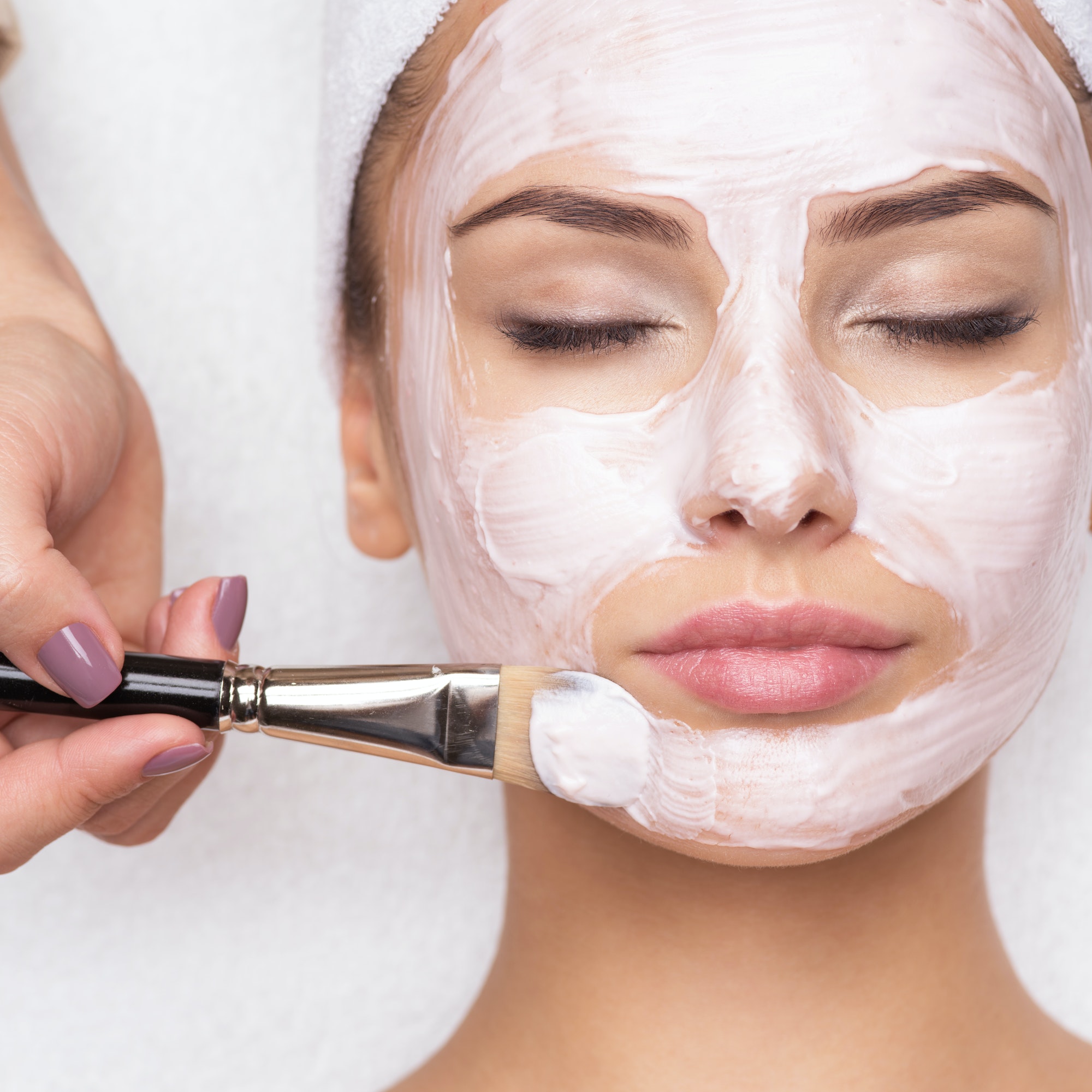 woman-receiving-facial-mask-at-beauty-salon.jpg